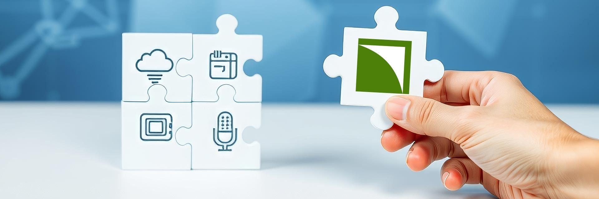 Bild zeigt Puzzleteile mit Symbolen für digitale Kompetenzen und eines mit dem Netzwerk-Logo.